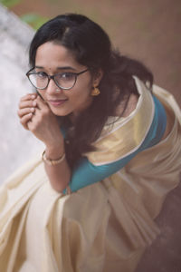 High angle portrait of a young woman taken during the onam festival.