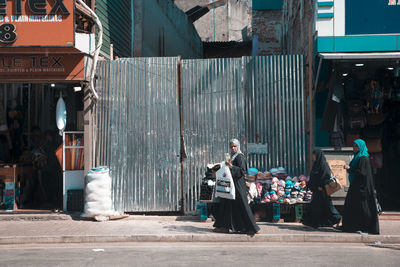 People standing on street in city