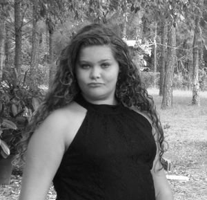 Portrait of young woman in forest