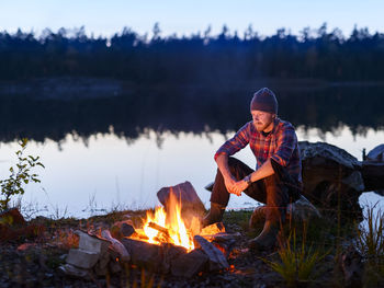 Man having campfire