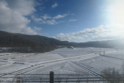 Scenic view of snowcapped mountains against sky