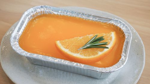 High angle view of orange slice in plate on table