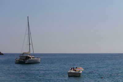 Boats sailing in sea