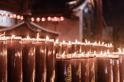Illuminated candles in temple