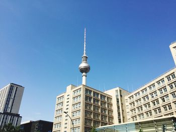 Low angle view of buildings against blue sky