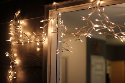 Illuminated string lights on house during christmas at night