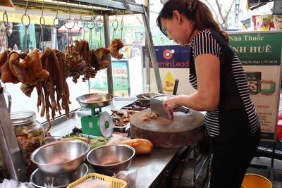 Midsection of man preparing food