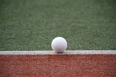 Close-up of ball on grassland