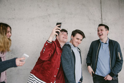 Young couple holding mobile phone