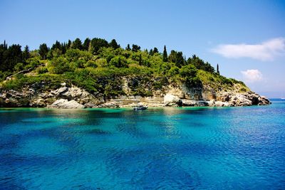 Scenic view of swimming pool by sea against sky