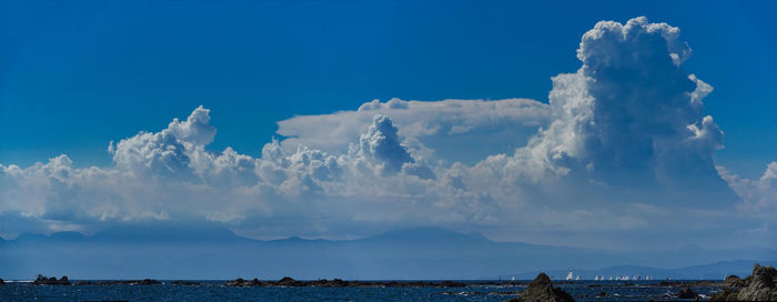 Panoramic view of sea against cloudy sky