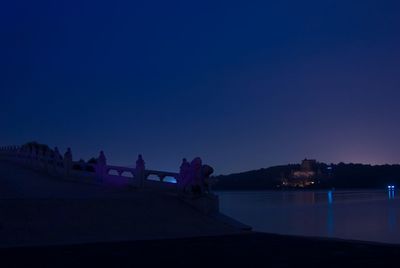 Scenic view of illuminated clear blue sky at night