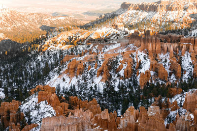 Far away zoom shot of bryce canyon national park of the hoodoos at inspiration point in winter