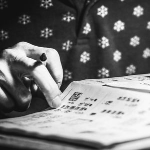 Close-up of hand holding book