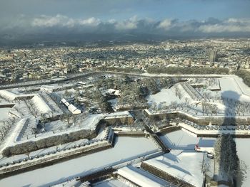 High angle view of cityscape against sky during winter