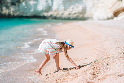 Full length of girl on sand at beach