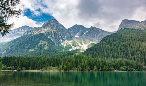 Scenic view of lake and mountains against sky