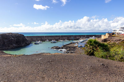 Panoramic view at the coastline of el cotillo on canary island fuerteventura, spain with lava rocks 