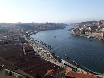 High angle view of river and buildings in city