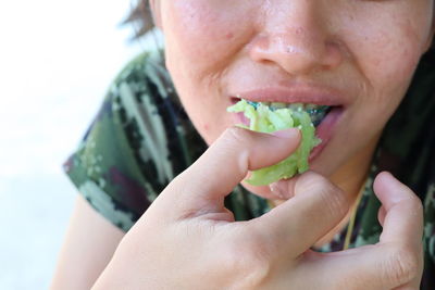 Close-up of man eating food