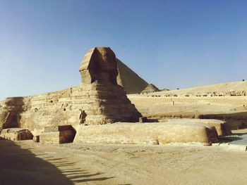 Great sphinx of giza against blue sky