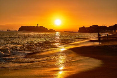 Scenic view of sea against sky during sunset