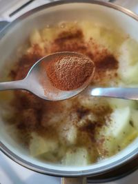 High angle view of coffee in cup on table