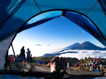 Group of people relaxing on mountain road