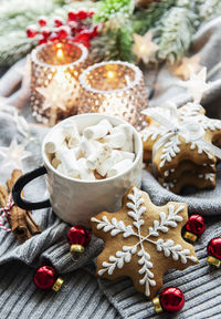 Christmas decorations, cocoa and gingerbread cookies. white wooden background.