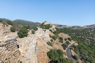 Scenic view of mountains against clear blue sky