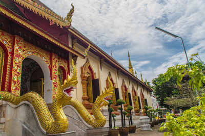 Low angle view of temple against building