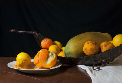 Close-up of fruits in plate on table