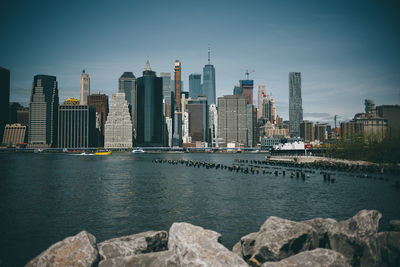 City at waterfront against sky