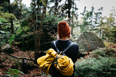 Rear view of woman in forest