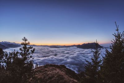 Scenic view of snowcapped mountains against clear sky during winter