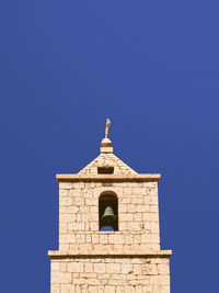 High section of church against clear blue sky