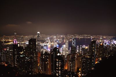 High angle view of illuminated city buildings at night