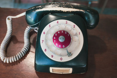 High angle view of telephone booth on table