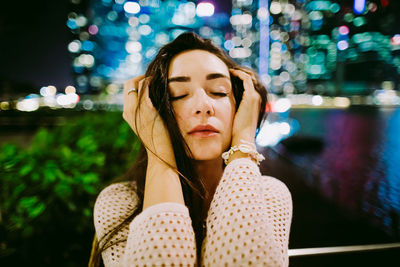 Portrait of woman sitting outdoors