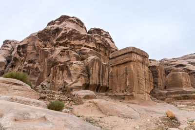 Low angle view of rock formation against clear sky