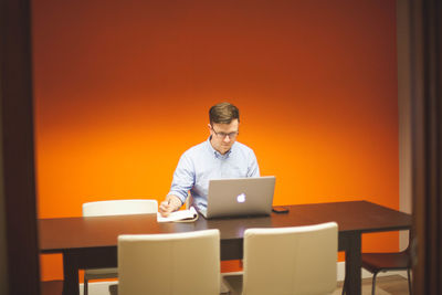 Man using laptop on table