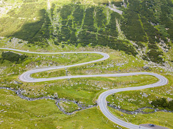 High angle view of winding road amidst trees