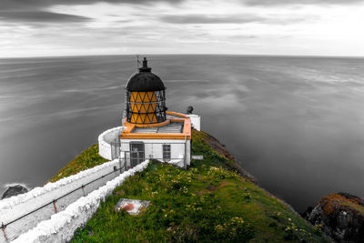 Castle by sea against sky