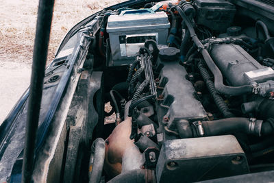 Open hood of the car. view of the engine and vehicle parts. diagnostics and repair of an old car.