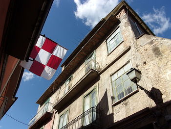 Low angle view of flag against sky