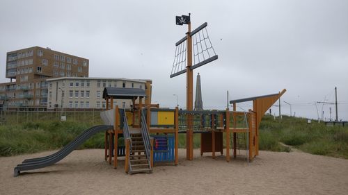 Lifeguard hut on beach against sky