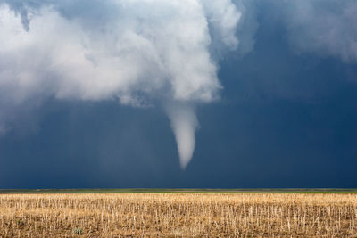 Scenic view of tornado over field