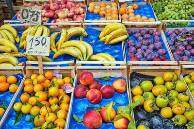 Fresh fruits in wooden boxes for sale at a market