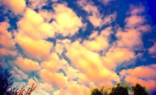 Low angle view of cloudy sky at sunset