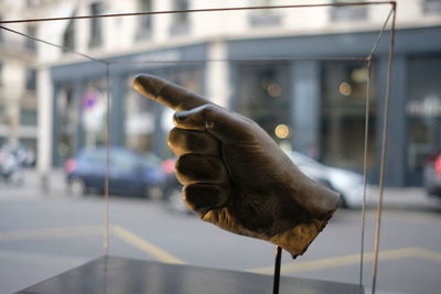 Close-up of a hand holding a car